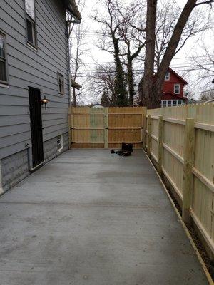 New concrete and privacy fence.