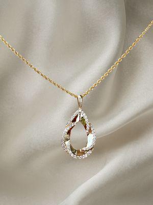 Make a statement at every Gulf Coast event with our exquisite 14K yellow gold pendant, adorned with .25ct diamonds!