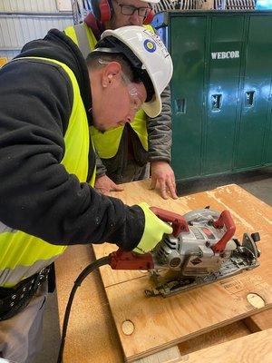 Students get hands on experience with basic construction tools.