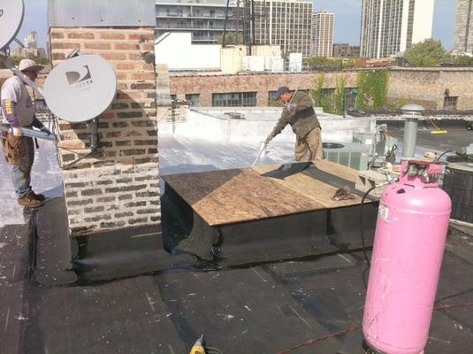 Rewbuilt skylight walls. new rafters, New insulation on the deck and walls. Chimney and skylight have new roof flashing.