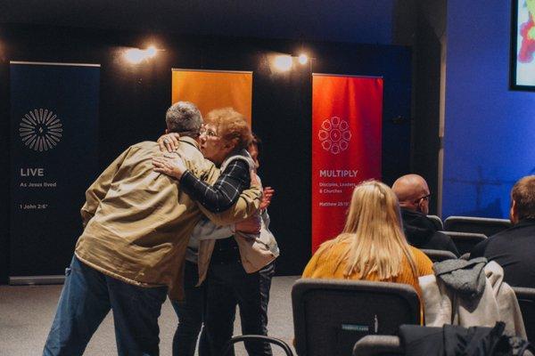 Congregants greeting one another