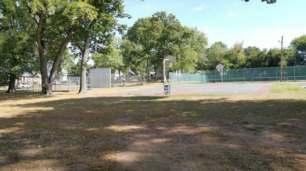 Basketball court and handball court in the background.