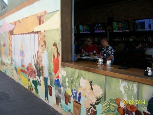 Bar and grill with open window to the Culver City Farmers Market on the Many Worlds of Culver City Tour!