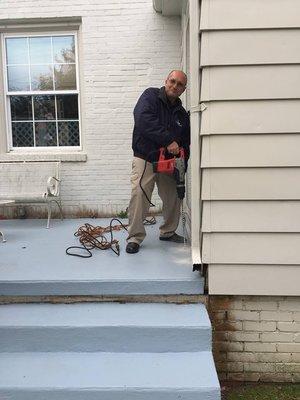 Owner Brian Distler doing a termite treatment