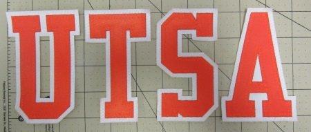 Loose letters 5" high orange foreground white background tackle twill with zigzag on the edge