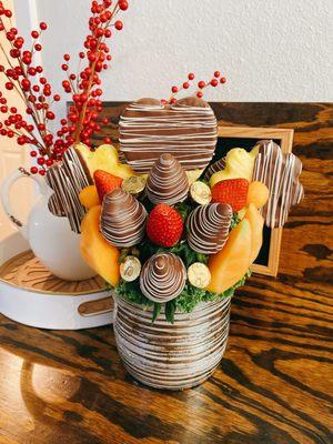 Fruit arrangements , fresh strawberries with chocolate, pineapple, cantaloupe,orange.