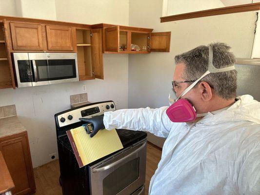 Inspecting a rental home vandalized by the previous tenants.