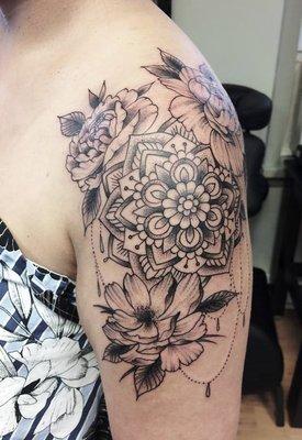 Mandala and flowers tattoo by Brandon