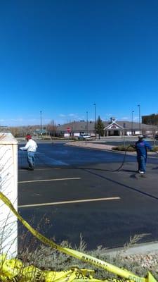 We cleaned cracked filled and seal coated the entire parking lot and striped