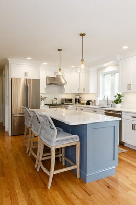 Kitchen remodel using existing cabinetry, light carpentry and cabinet painting.