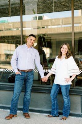 Two people in front of coffee shop