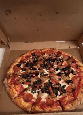 Large pizza with black olives, sausage and pepperoni