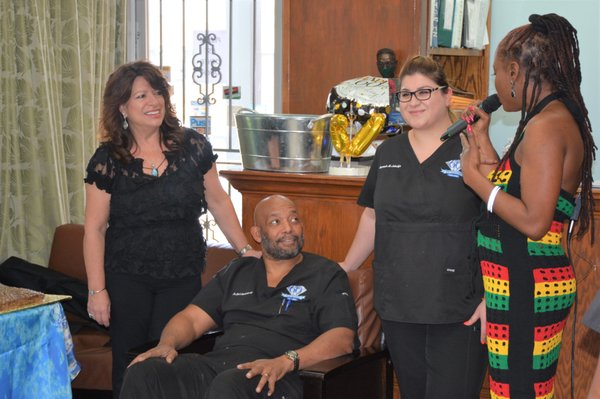 Dr. Zeb F. Poindexter III is serenade during his 60th birthday celebration at Poindexter Dental Inc.