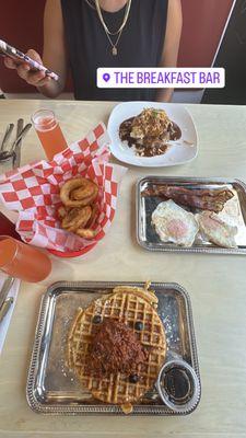 Top- loco moco Middle- onion rings, eggs, bacon  Bottom- Chicken & waffles  Drinks- pineapple mimosas