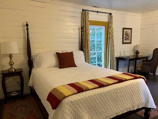 The Laura room with a queen sized bed located on the 2nd floor.