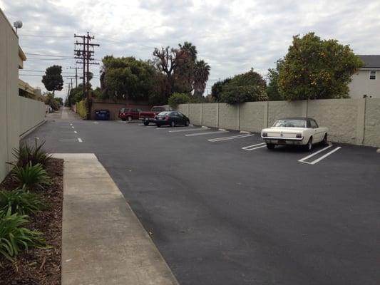 Ample amount of parking spaces located beside and behind the building.