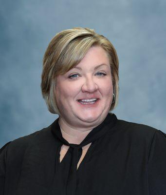 Employee at a corporate organization pose for employee headshots