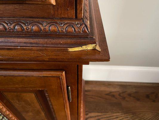 Chip wood off in several location on China Cabinet