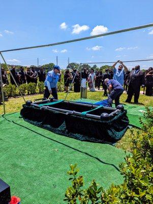 Dignity Memorial employees performing burial.