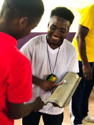 Learning Jamaican rhythm using a kitchen grater and a fork