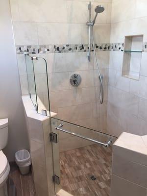 Wonderful shower walls, accents, floor & pony wall. We love it.