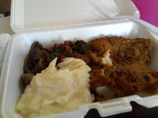 A meal of spinach, mash potatoes, mushrooms and fried tilapia