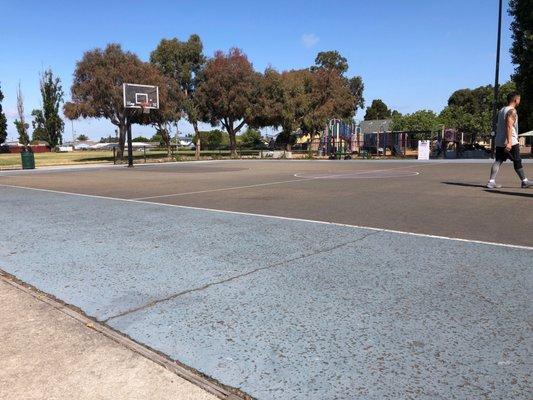 Full court with 3 point line. Has lights for night games. Court surface is slippery, so don't be fooled.