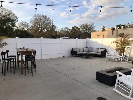 Cool little back patio with fire features and assorted seating areas.