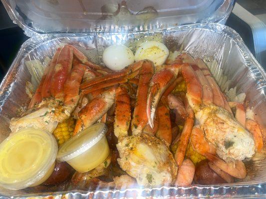 This is the Seafood platter with 3 crab leg clusters, 1 lb of shrimp, 4 corns, 4 potatoes, & sausage