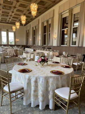 Gold Chiavari Chairs w/White Pad, Gold Leafed Beaded Chargers, Burgundy Lamour Satin Napkins on Ivory Laylani Lace Overlay