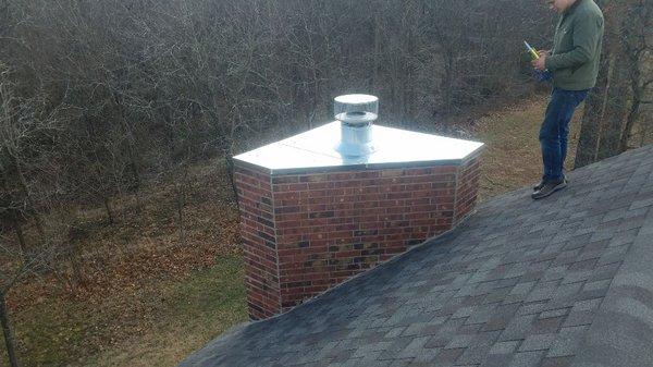 Hand made chimney cap for custom backyard fireplace.