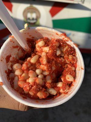 White corn in a cup with butter, crema, queso fresco, chile. Try adding hot cheeto crumbs!