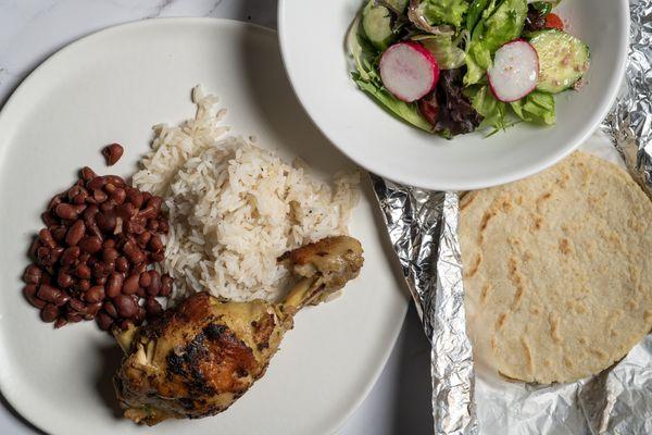 Baked & grilled marinated chicken - stewed kidney beans, white rice, corn tortillas, and salad.