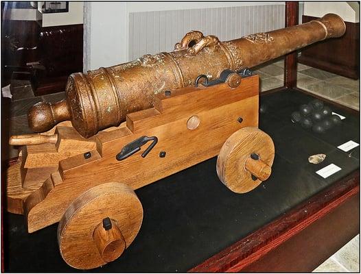 This is a cannon recovered from the La Belle.  The wooden carriage is a modern reproduction made to support the cannon for display.