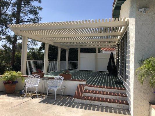 We love our new patio on our deck with privacy walls and rails so no one falls off the deck!