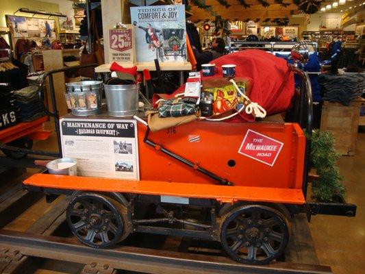 Front entry Christmas display on an old railroad cart - cool!