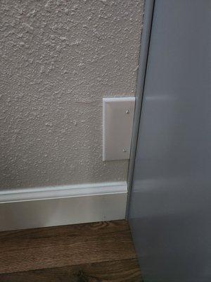 Should have moved the outlet before installing cabinets