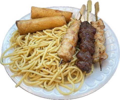 2 chicken and 1 beef skewers, garlic butter noodles, and 2 egg rolls