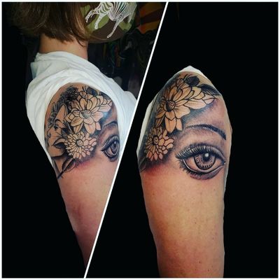 Freehand eye with floral woman design