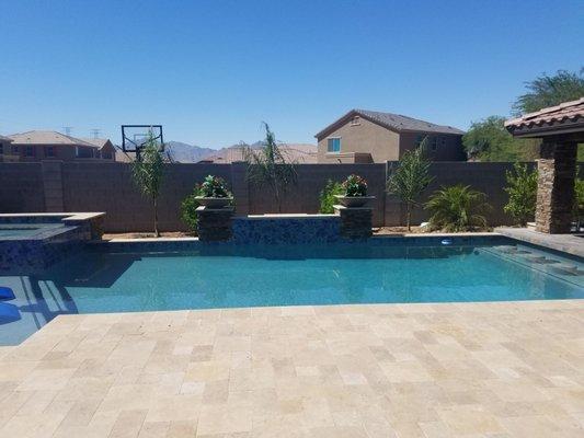 Columns with raised wall water feature and planter pots