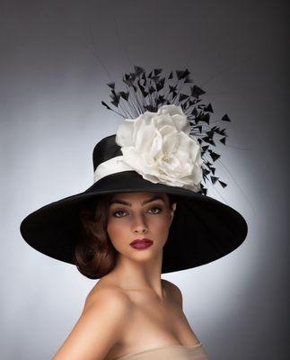 Beautiful black and white derby hat made of black taffeta, silk satin rose and goose feathers. Perfect for opening day! unbacioboutique.com