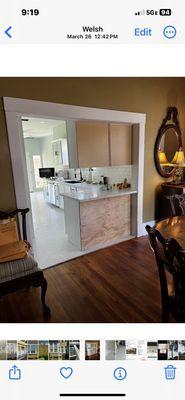 This is how cabinets were finished out looking from dining room cabinets should have glass on top cabinets and bottom one was left unpainted