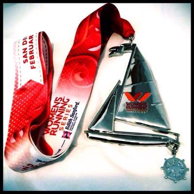 The 2014 medal for the Competitor's Running Women's Half for San Diego.