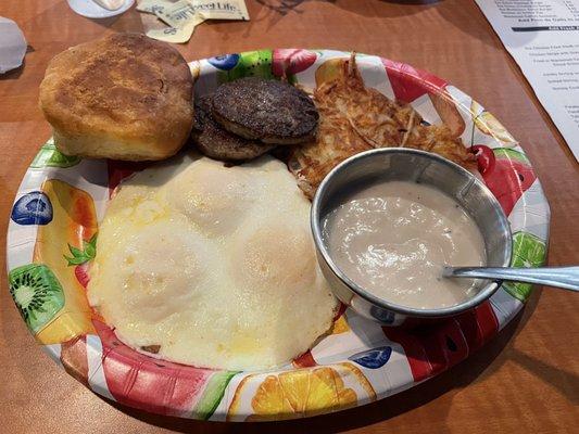 3 eggs, hash browns, sausage with biscuits an gravy...on a paper plate