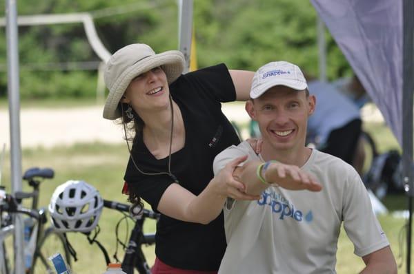 Claire treating a team Snapple Elite triathlete...and singing at the same time!