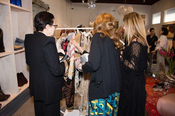 Guests ogle the racks during Mona Moore's opening celebration at 208 Lincoln Blvd.