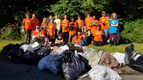 The "Kids' Service Team" participating in a Source to Sea River cleanup