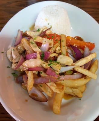 Pollo Saltado - Grilled chicken, French fries, and sautéed veggies with white rice