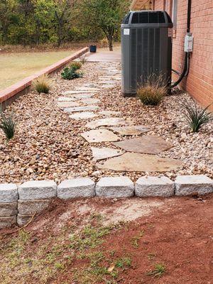 Back from garage side showing the path and plants the hardscape looks great.