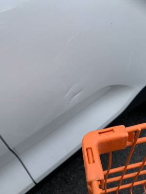 Orange Home Depot Shopping cart similar matching the dents and Orange paint inside the dents